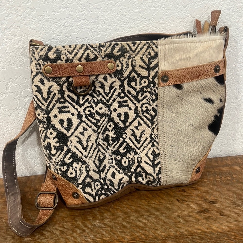 myra cowhide bag. like new.